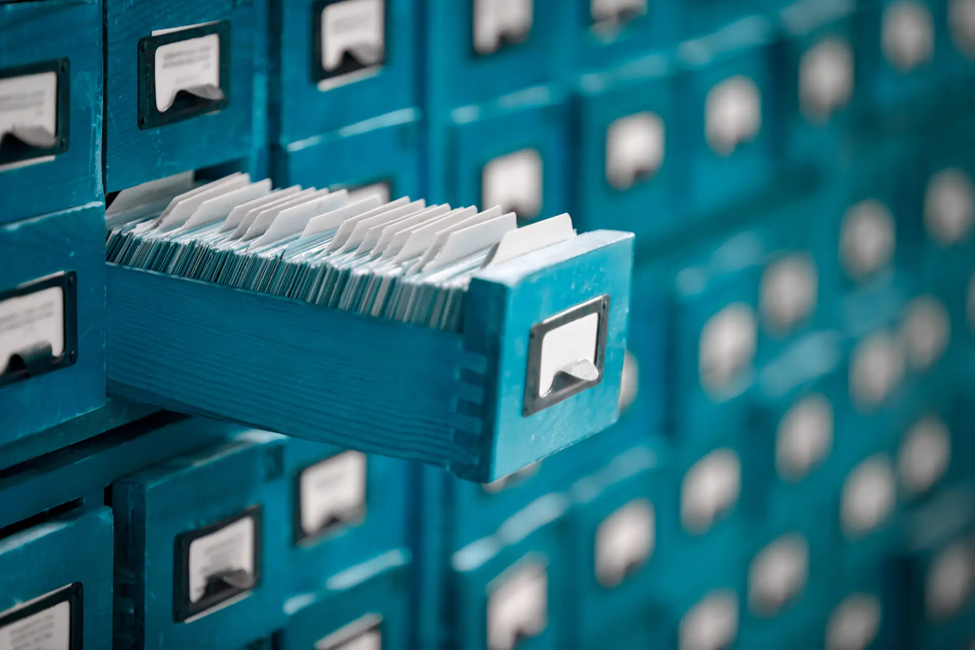 Old library or archive reference catalogue with opened card drawer.